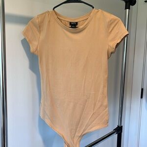 Women’s rue 21 beige short sleeve body suit.